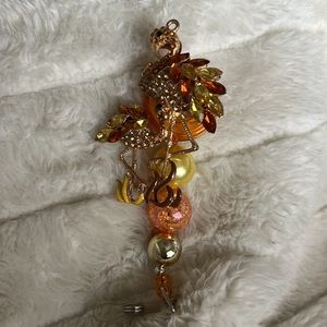Yellow and brown rhinestone flamingo badge reel